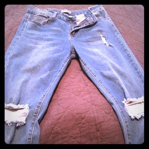 Distressed skinny jeans.